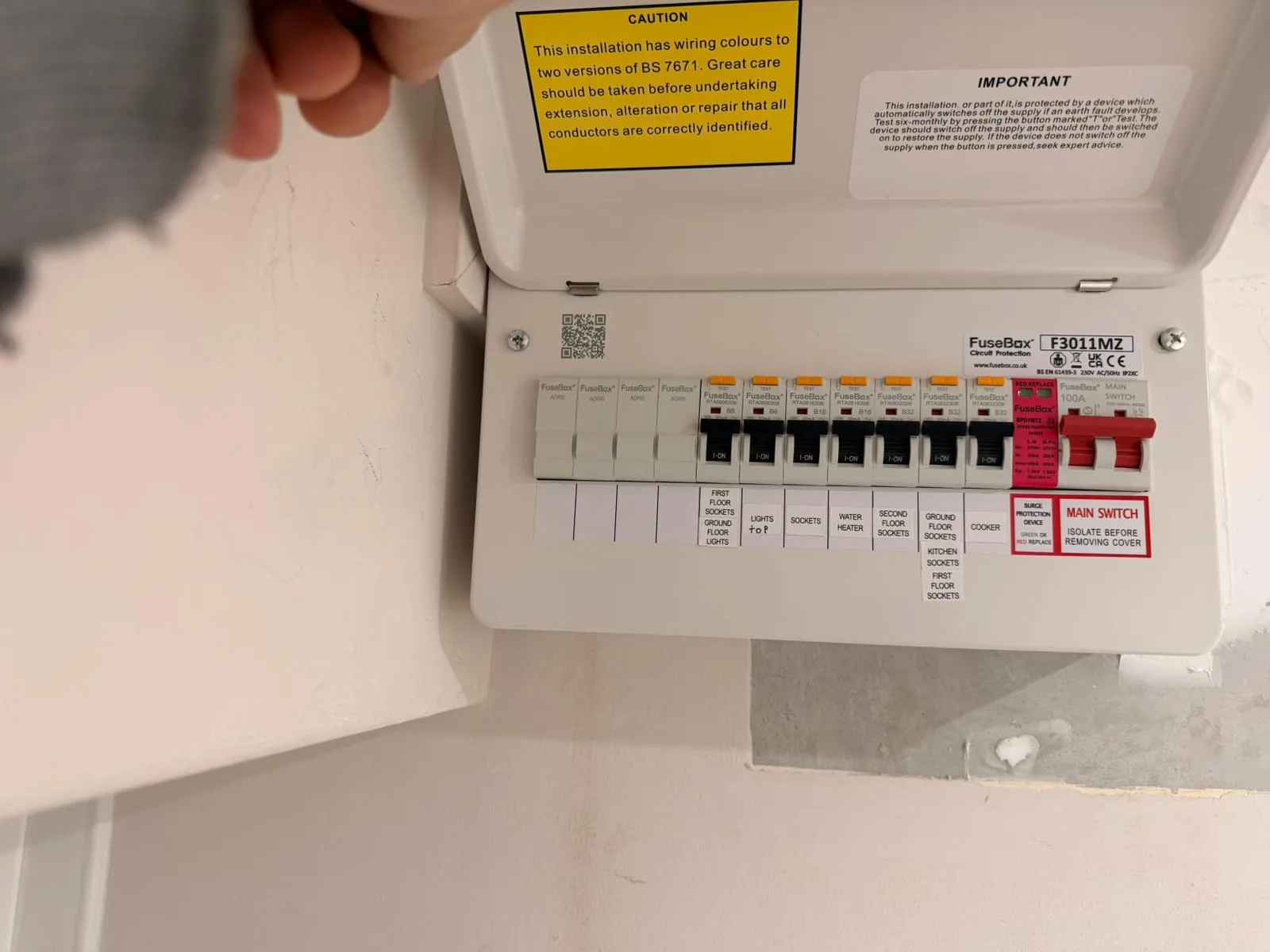 Fully labelled consumer unit after a compliant EICR and upgrade — every circuit identified and a clear surge-protection device fitted
