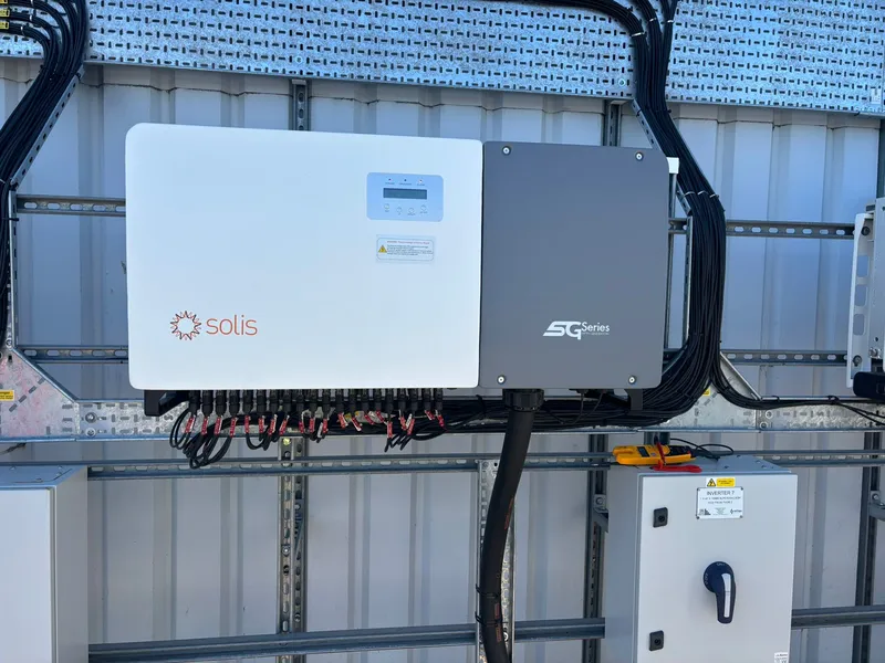 Solis commercial inverter with neat DC cabling on industrial unit wall