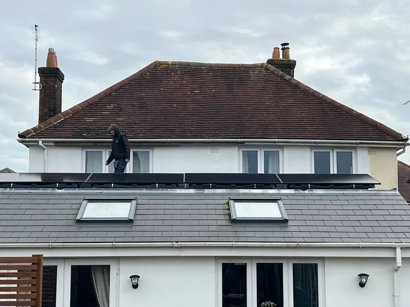 Solar panel installation on residential flat roof extension in Poole